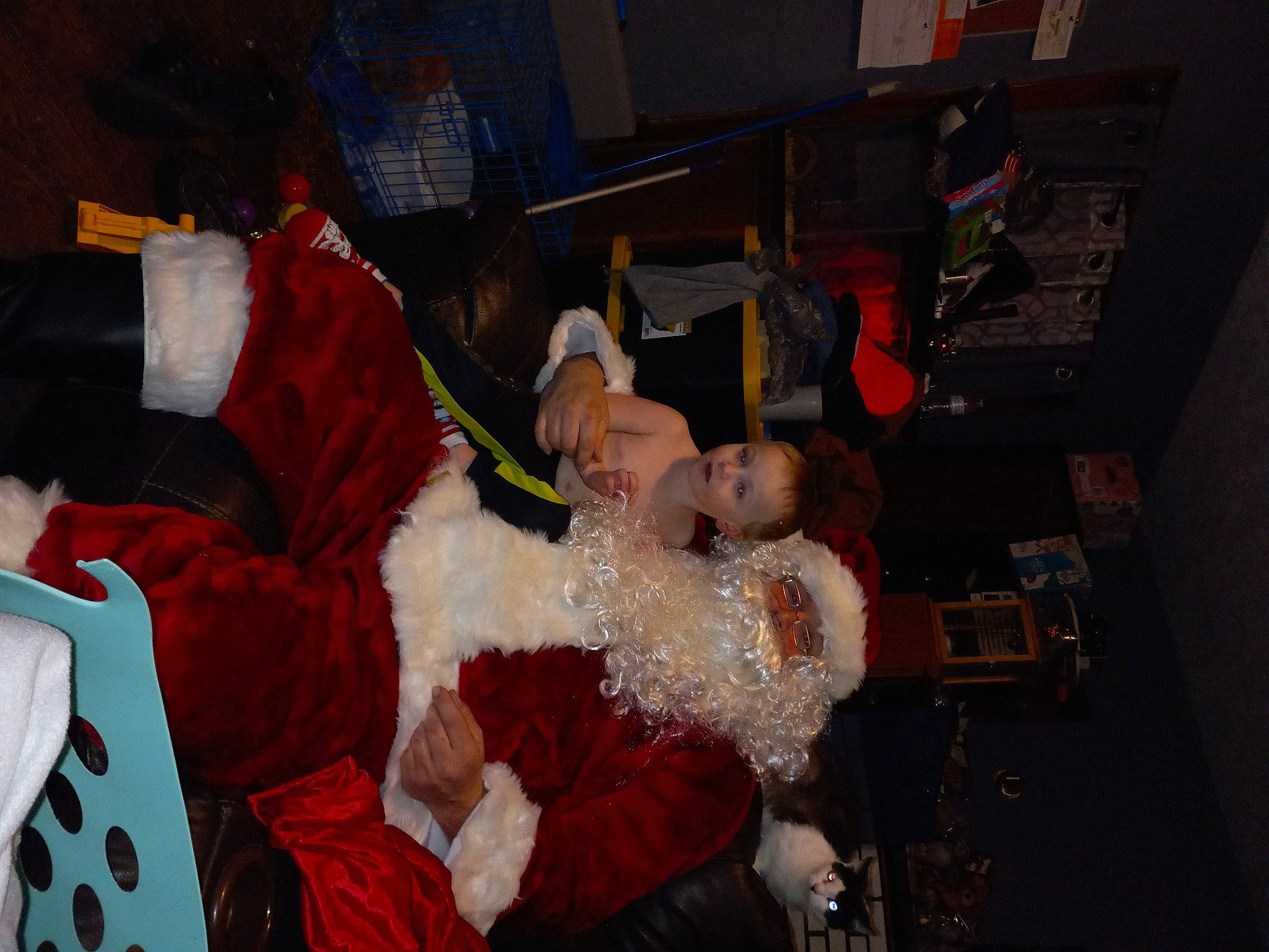 Dallas Kinser joined the competition — help win amazing prizes! carmine, child, christmas, christmas_decoration, christmas_eve, christmas_ornament, costume, event, fictional_character, fun, fur, fur_clothing, hat, holiday, lap, person, room, santa_claus, tradition, tree