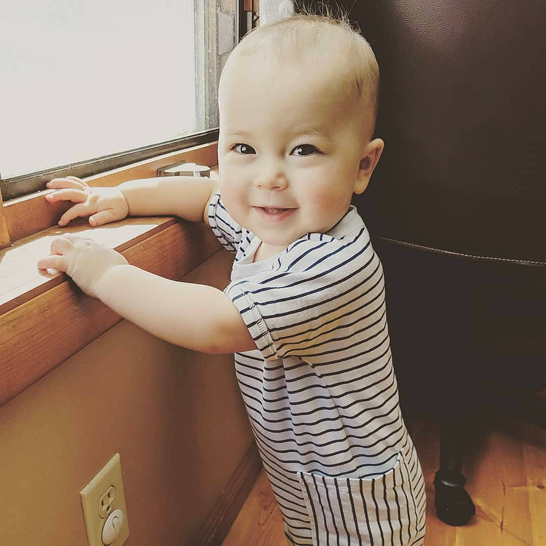 Aila is registered to the contest to win money with this photo: arm, baby, cheek, child, chin, cool, eye, face, forehead, hair, hairstyle, head, human, joint, male, nose, person, shoulder, skin, standing