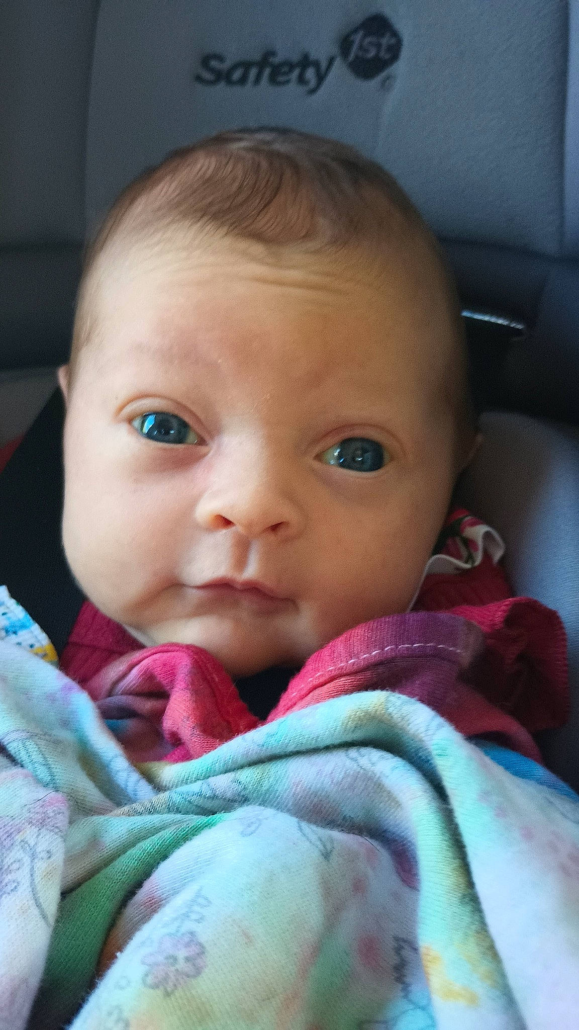 Audrey is registered to the contest to win money with this photo: baby, baby_toddler_clothing, car_seat, cheek, child, chin, comfort, eyebrow, eyelash, forehead, fun, iris, linens, lip, mouth, nose, person, sitting, skin, toddler