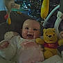 baby, baby_bouncer, child, christmas_tree, clothing, cute, face, festive, happy, holiday, indoor, infant, lights, playtime, seat, smile, soft_toys, stuffed_animal, toy, winnie_the_pooh