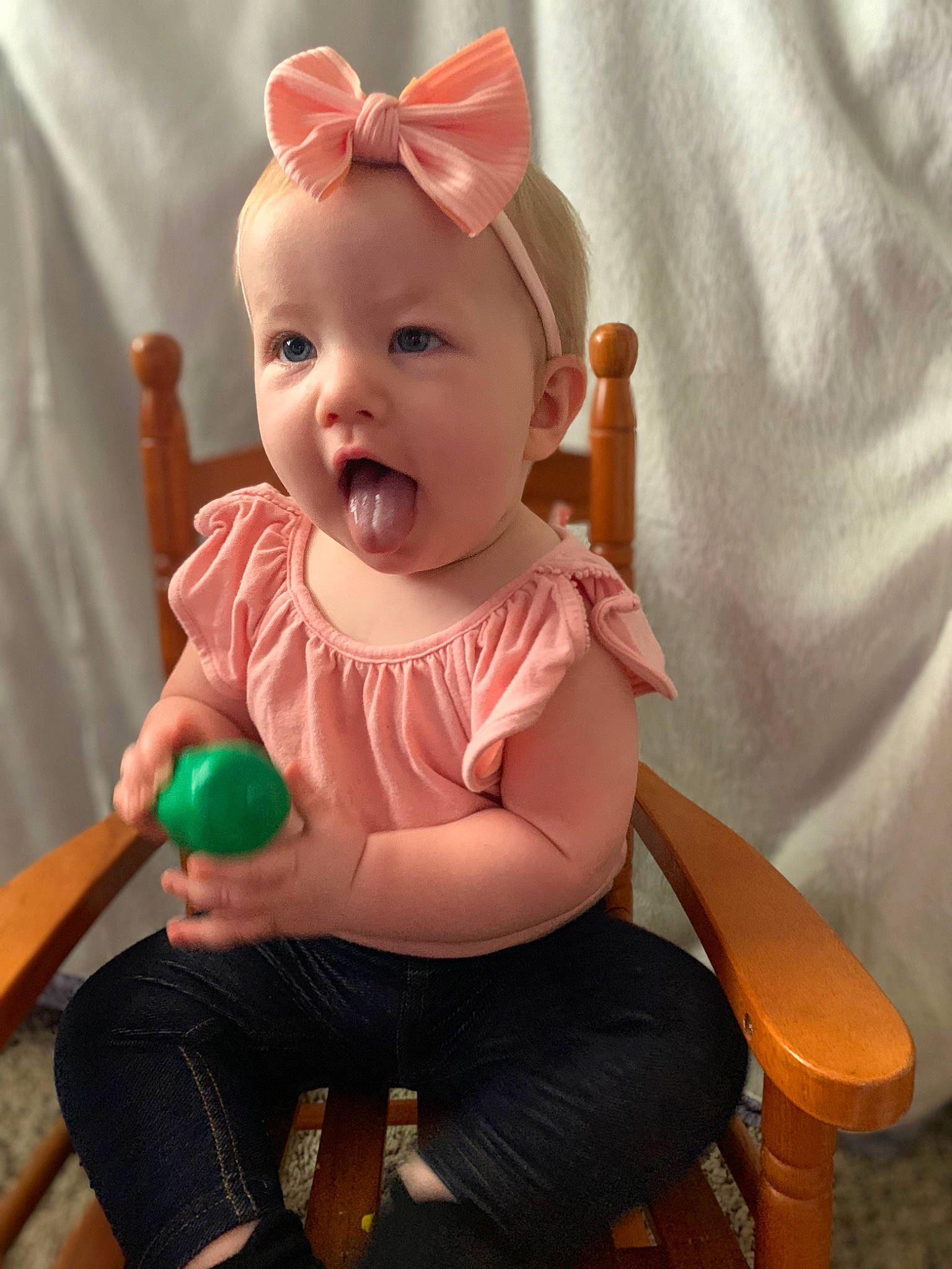 Evelynn joined the competition — help win amazing prizes! baby, baby_products, baby_toddler_clothing, chair, cheek, child, eye, facial_expression, finger, fun, hairstyle, happy, head, iris, person, pink, sitting, skin, sleeve, surprise