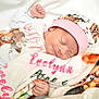 newborn, baby, sleeping, blanket, hat, onesie, animal_print, cozy, cute, infant, soft, peaceful, hand, face, portrait, clothing, resting, child, pink, white