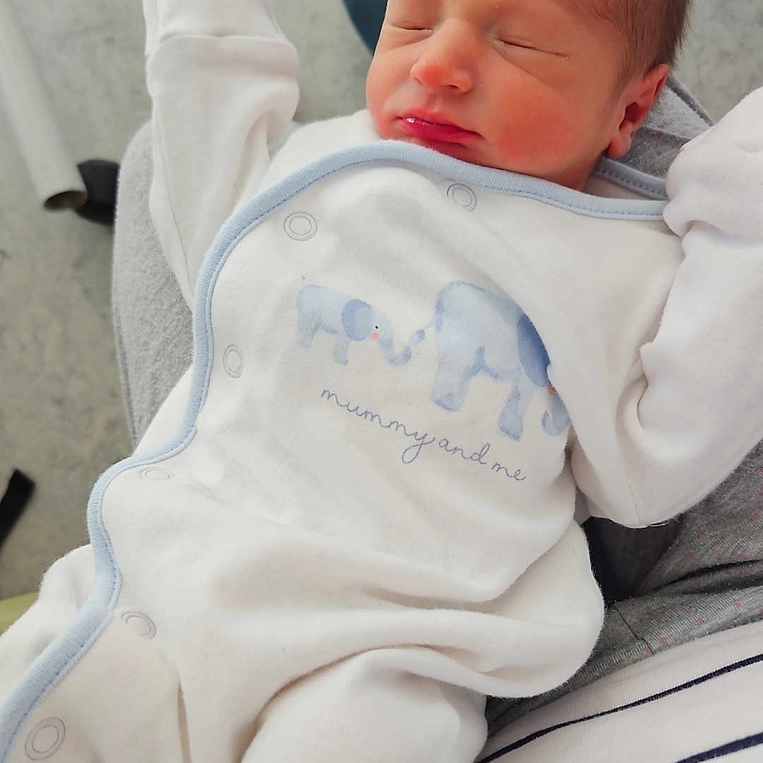 Theo Mills joined the competition — help win amazing prizes! architecture, baby, bed, blanket, bodypart, building, clothing, cushion, face, finger, furniture, hand, head, homedecor, hospital, newborn, person, photography, portrait, sleeping