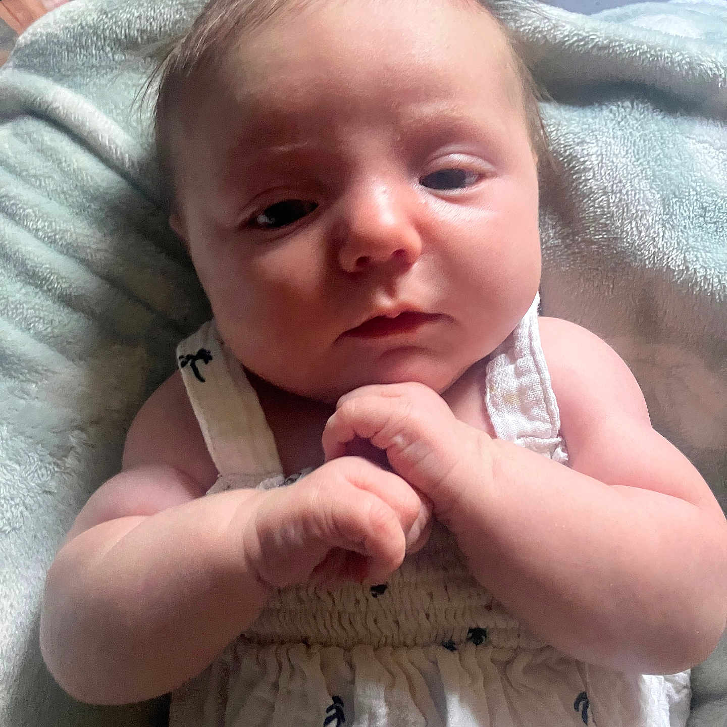 Bhodie-Leigh is registered to the contest to win money with this photo: baby, blanket, bodypart, clothing, dress, face, finger, frown, hand, happy, head, newborn, person, photography, portrait, quilt, sad, smile, towel, wrist