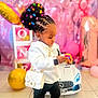 toddler, child, toy, birthday, balloons, pink, white_purse, smartwatch, boots, hair_clips, cornrows, indoor, car_toy, floor_tiles, party_decorations, blocks, colorful, cute, focused, celebration