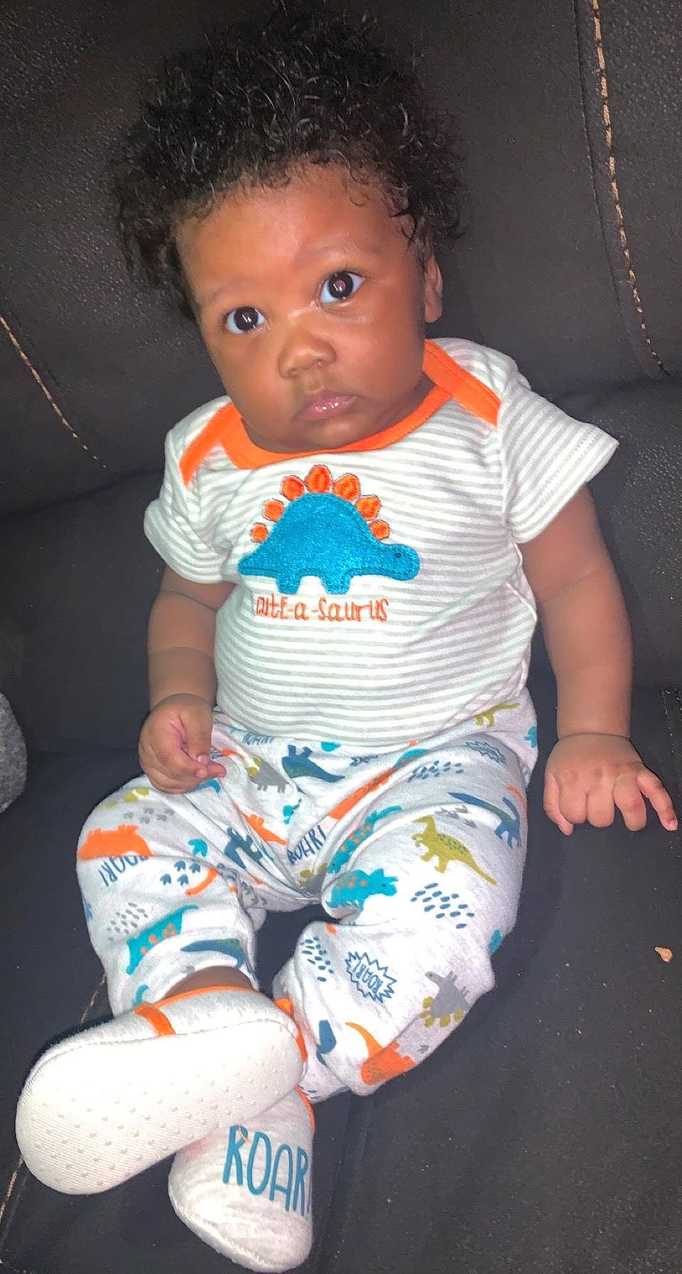 Quasa is registered to the contest to win money with this photo: arm, baby, baby_toddler_clothing, black, cheek, comfort, face, facial_expression, fun, iris, joint, mouth, nose, organ, pattern, person, skin, sleeve, t_shirt, toddler