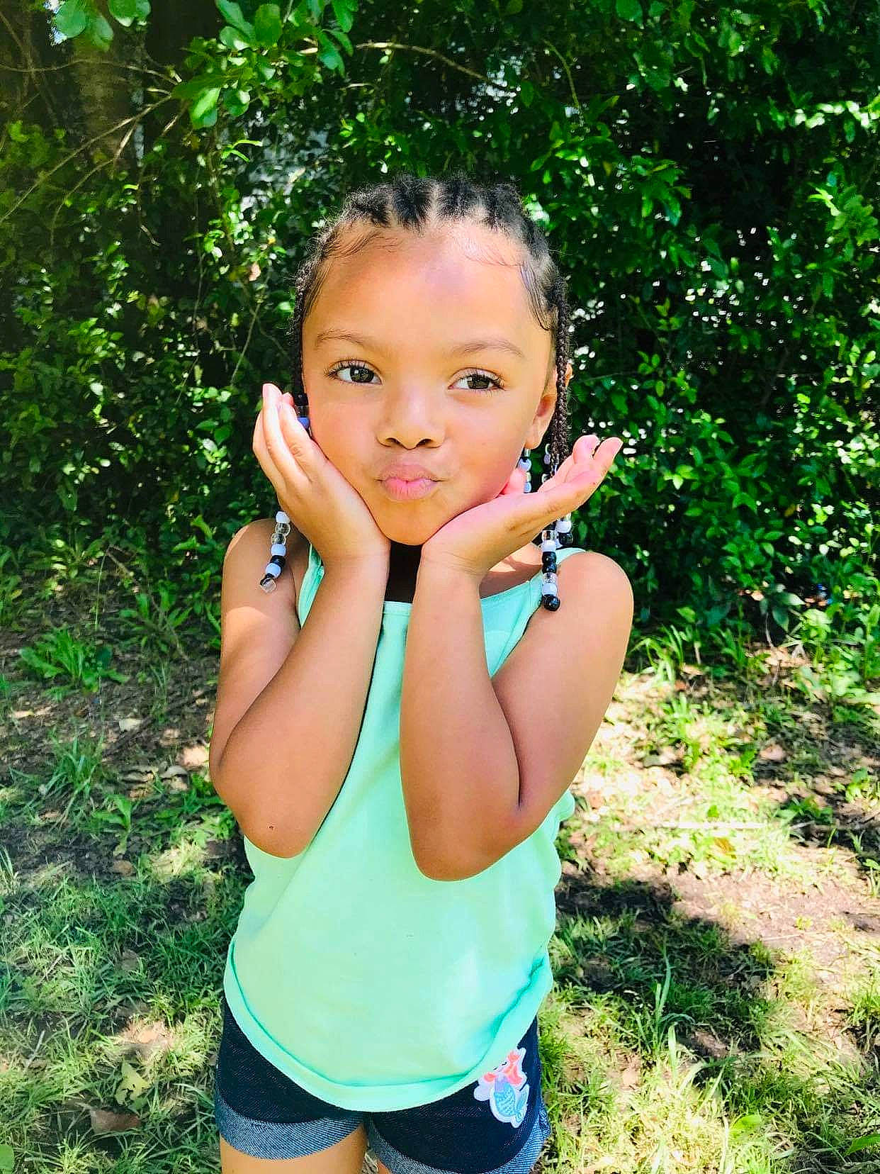 Ma'Laija is registered to the contest to win money with this photo: beauty, child, child_model, face, finger, grass, green, lip, person, photography, plant, smile, summer, tree, vacation
