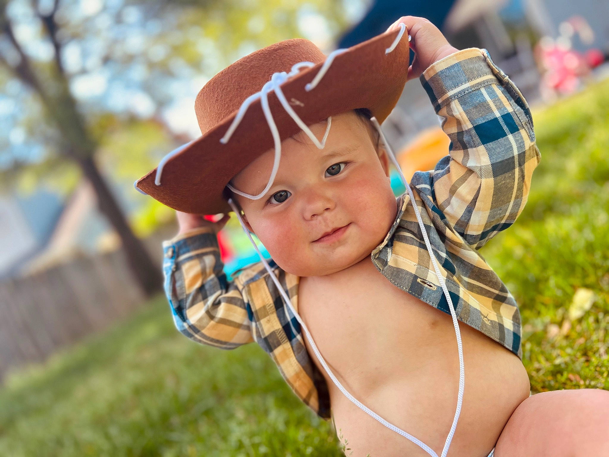 Romeo is registered to the contest to win money with this photo: cap, child, close_up, cool, costume_hat, electric_blue, facial_expression, finger, fun, grass, happy, hat, headwear, leaf, leisure, people_in_nature, person, skin, smile, sun_hat