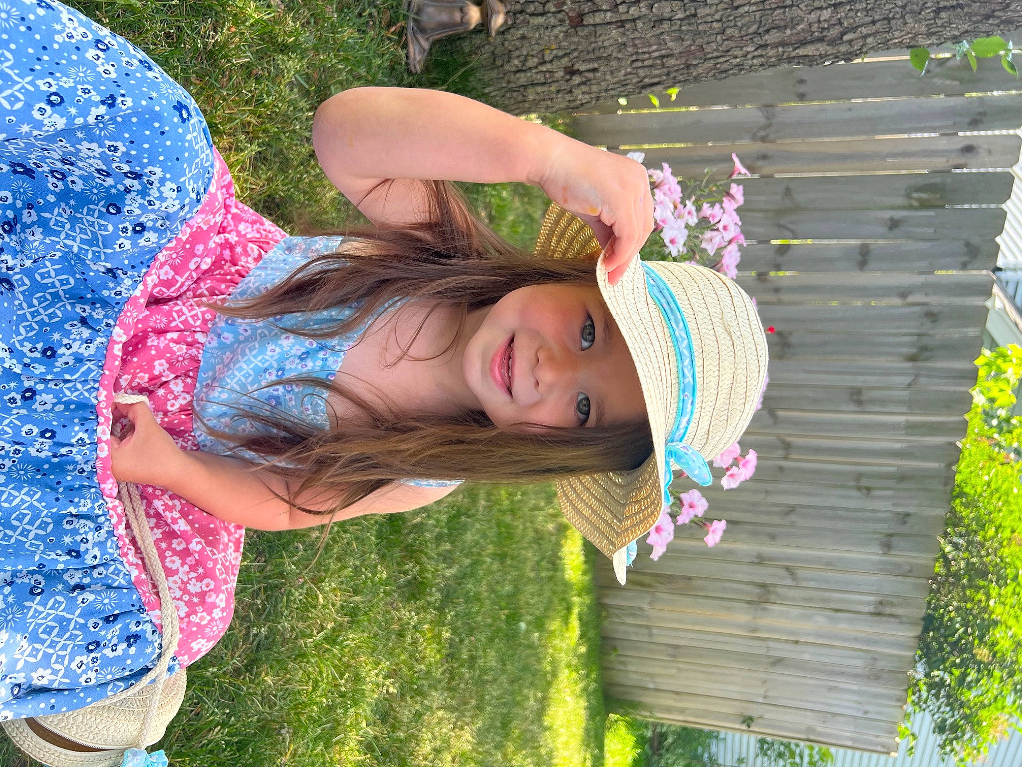 Della is registered to the contest to win money with this photo: blue, botany, child, fun, grass, grass_family, green, happy, headwear, joy, leaf, leisure, magenta, people_in_nature, person, pink, plant, purple, summer, textile