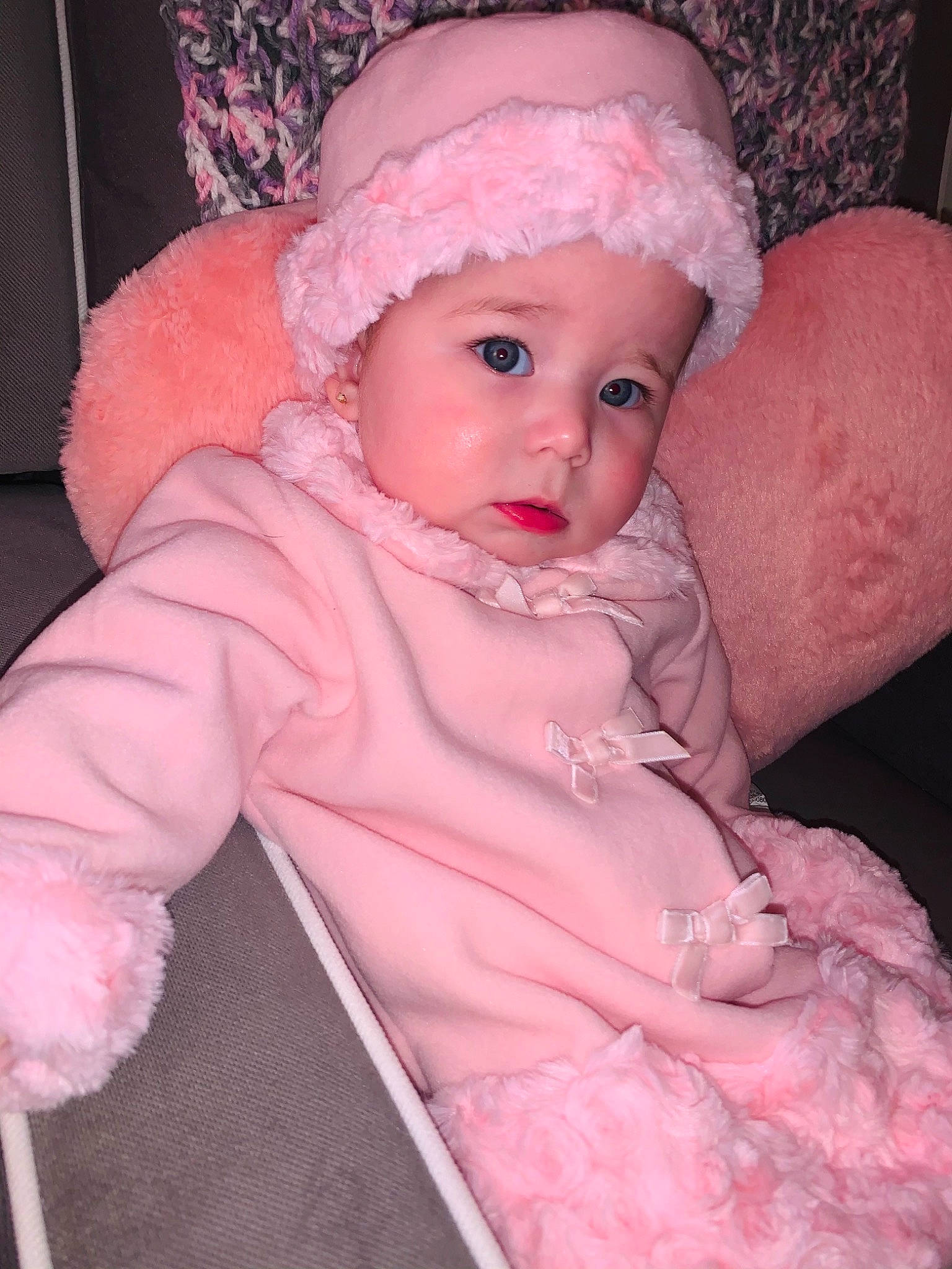 Della joined the competition — help win amazing prizes! baby, baby_products, baby_toddler_clothing, bonnet, cheek, costume_accessory, embellishment, fur, fur_clothing, hair_accessory, headpiece, headwear, natural_material, peach, person, pink, wool