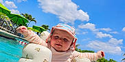 Aubriana joined the competition — help win amazing prizes! baby, bodypart, clothing, face, finger, fun, hand, hat, head, leisureactivities, nature, outdoors, person, photography, pool, portrait, summer, swimmingpool, vacation, water