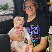 Aubriana is registered to the contest to win money with this photo: accessories, adult, baby, car, clothing, cushion, face, female, glasses, head, homedecor, machine, people, person, photography, portrait, t_shirt, transportation, vehicle, woman