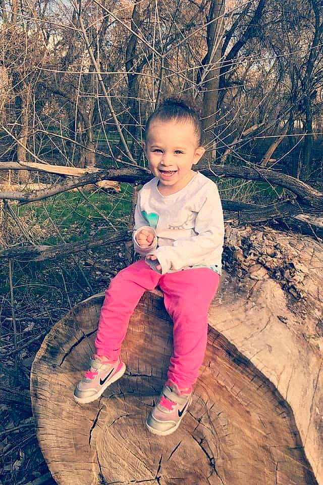 Giselle is registered to the contest to win money with this photo: child, child_model, family, fun, happy, joy, people, person, photograph, photography, pink, plant, play, recreation, sitting, smile, toddler, tree, trunk, vacation