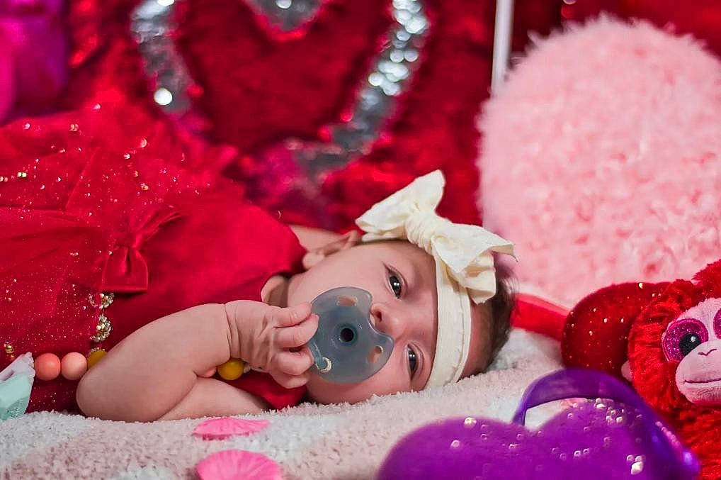 Nevaeh is registered to the contest to win money with this photo: baby, baby_toddler_clothing, cheek, child, doll, event, facial_expression, happy, headwear, magenta, person, pink, plush, purple, red, skin, stuffed_toy, sweetness, teddy_bear, textile