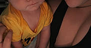 Daniel is registered to the contest to win money with this photo: baby, infant, adult, parent, selfie, portrait, cuddling, holding, face, smiling, sleepy, yellow_shirt, black_clothing, indoors, close_up, family, baby_clothing, arms, dim_lighting, nike