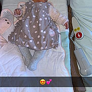 Kassidy participe au concours pour gagner de l'argent avec cette photo : baby, newborn, sleeping, polka_dot, dress, hat, knitted, hospital_bed, soft_toys, blanket, infant, cute, resting, child, indoors, comfort, peaceful, person, lying_down, adorable