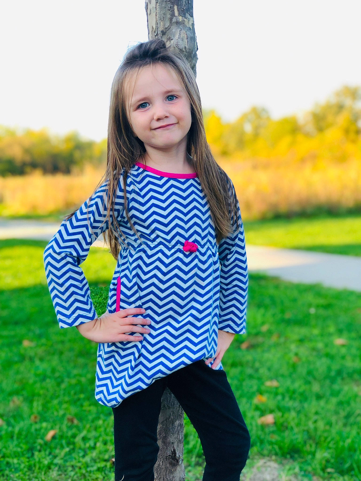 Madisen is registered to the contest to win money with this photo: autumn, child, costume, design, grass, happy, joy, leaf, outerwear, pattern, person, plant, play, pumpkin, sleeve, smile, toddler, yellow