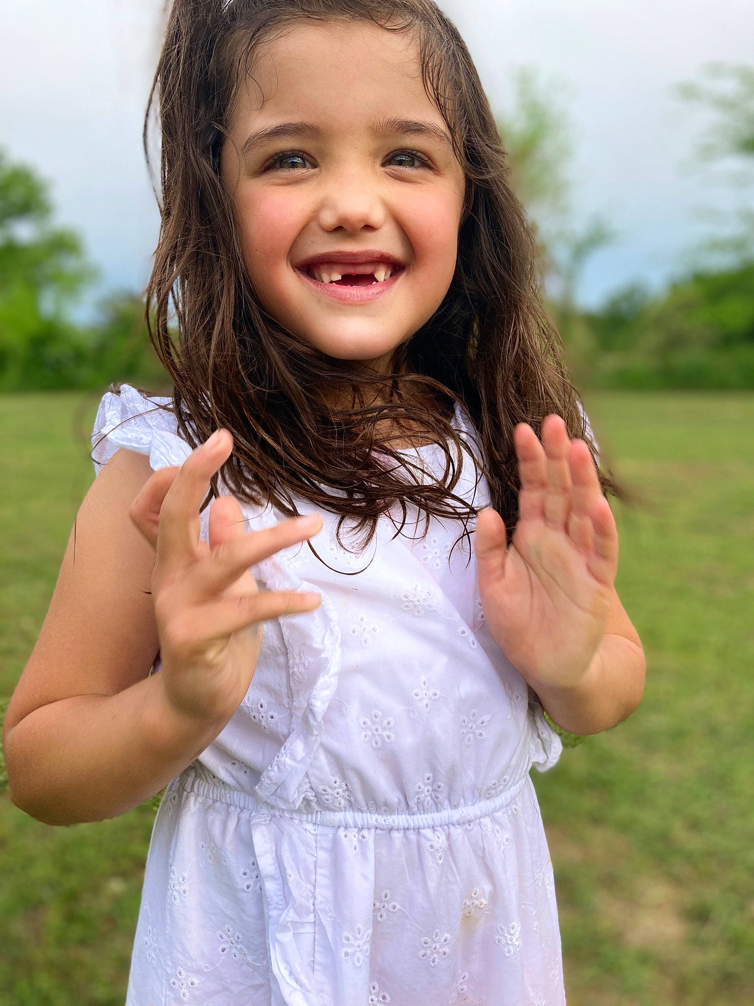 Annamarie is registered to the contest to win money with this photo: arm, eye, face, facial_expression, finger, flash_photography, gesture, hairstyle, hand, happy, joy, lip, neck, people_in_nature, person, plant, shoulder, skin, sky, sleeve