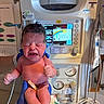 newborn, baby, crying, medical_equipment, hospital, panda_warmer, gloved_hands, infant, person, monitor, temperature_display, umbilical_cord, medical_tubes, healthcare, clinic, fresh_born, patient, neonatal_care, human, birth