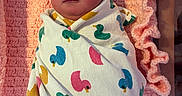 Veda joined the competition — help win amazing prizes! newborn, baby, swaddled, blanket, duck_pattern, sleeping, pink, crocheted, soft, infant, face, head, person, cute, resting, indoors, closeup, wrapped, peaceful, child