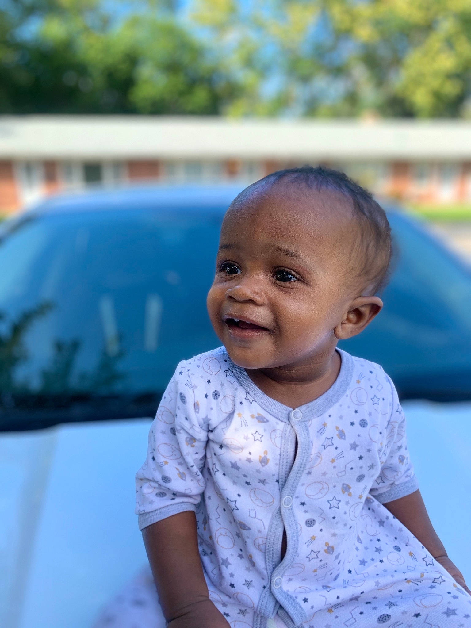 Kailand is registered to the contest to win money with this photo: automotive_design, automotive_exterior, automotive_lighting, baby, baby_toddler_clothing, car, child, electric_blue, family_car, fun, grass, happy, hood, joy, leisure, motor_vehicle, person, recreation, skin, smile