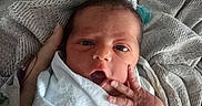 Emery is registered to the contest to win money with this photo: newborn, baby, infant, blanket, hand, face, eyes, wrapped, cozy, texture, fabric, bed, resting, cute, small, skin, person, portrait, indoors, soft