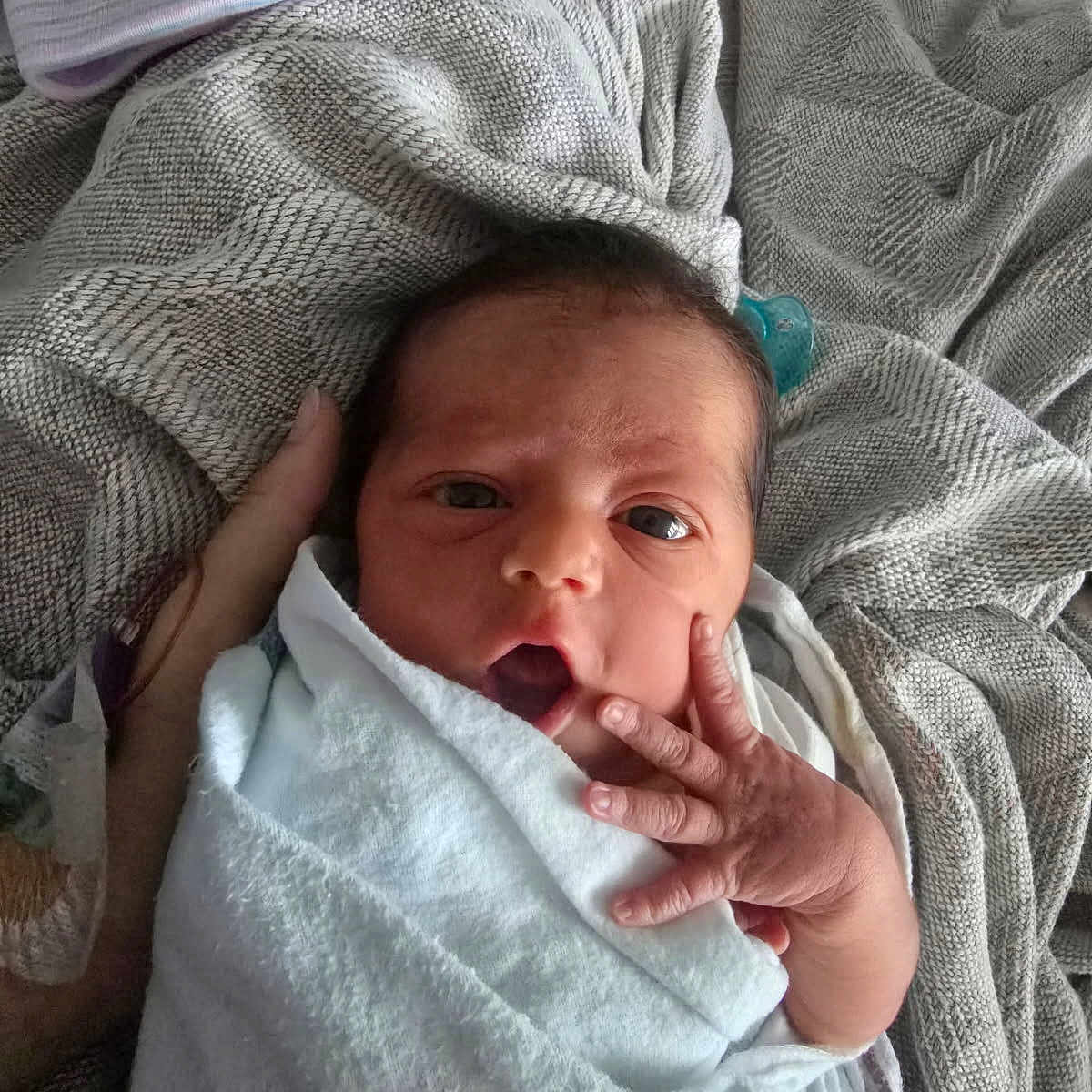 Emery is registered to the contest to win money with this photo: newborn, baby, infant, blanket, hand, face, eyes, wrapped, cozy, texture, fabric, bed, resting, cute, small, skin, person, portrait, indoors, soft
