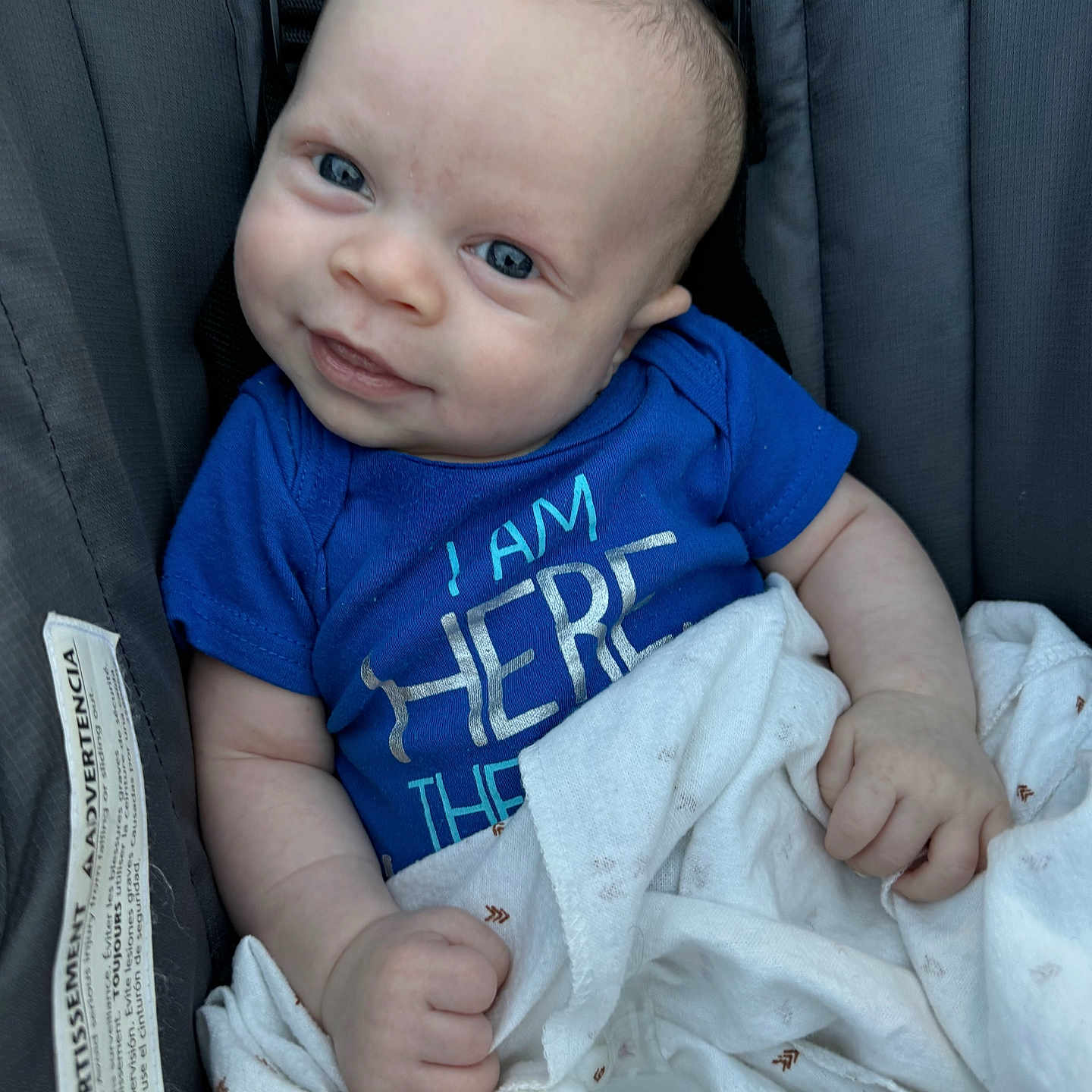 James joined the competition — help win amazing prizes! baby, blanket, bodypart, clothing, couch, cushion, face, finger, hand, happy, head, homedecor, newborn, pants, person, photography, portrait, smile, t_shirt, text