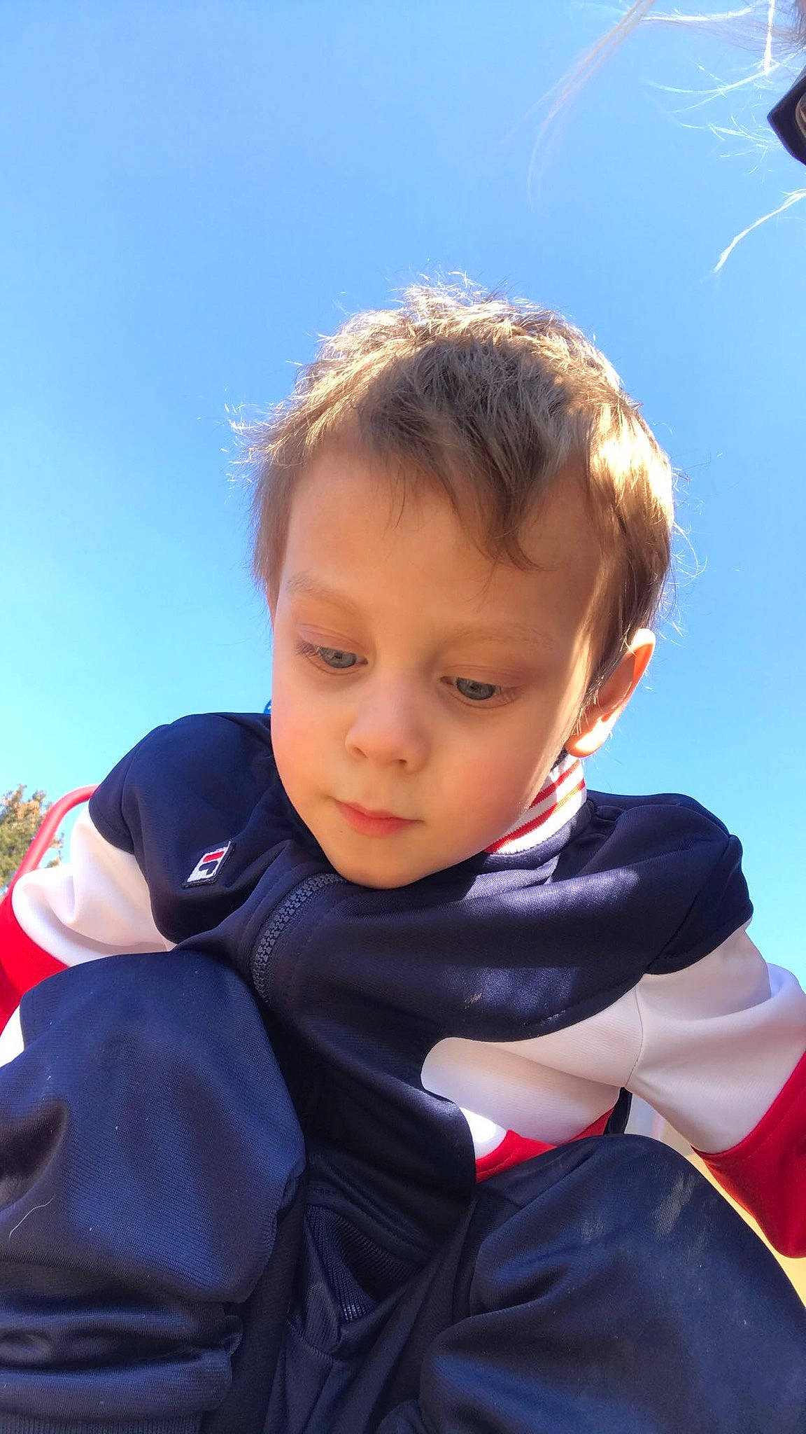 Jericho joined the competition — help win amazing prizes! child, electric_blue, fun, grass, hair, hairstyle, happy, leisure, person, personal_protective_equipment, portrait_photography, recreation, sitting, sky, sleeve, toddler, tourism, travel, vacation, windbreaker