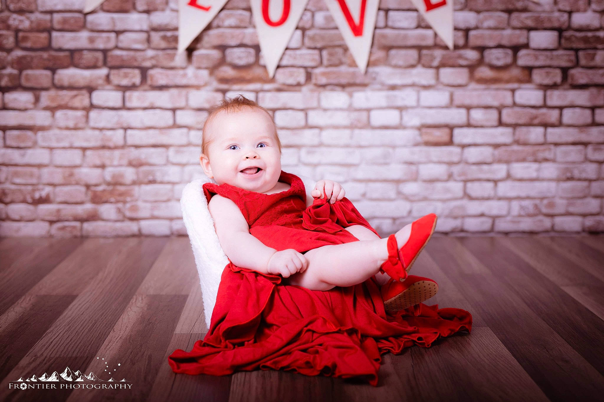 Carina is registered to the contest to win money with this photo: baby, cheek, child, child_model, dress, family, flash_photography, flooring, happy, people, person, photo_shoot, photograph, photography, portrait, portrait_photography, red, sitting, smile, stock_photography