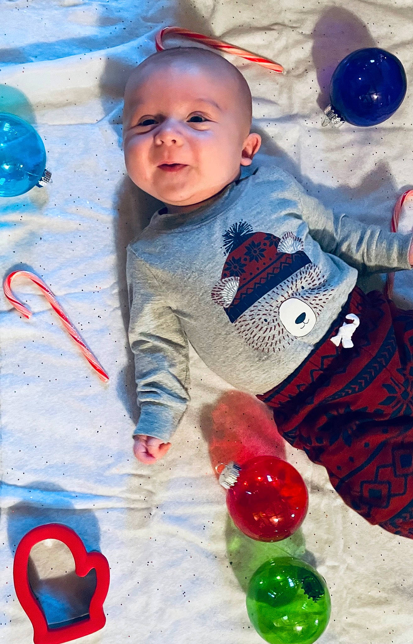 Denni is registered to the contest to win money with this photo: baby, baby_toddler_clothing, blue, cheek, child, event, fun, glass, happy, holiday, party_supply, pattern, person, play, portrait_photography, red, sitting, sleeve, toddler, water