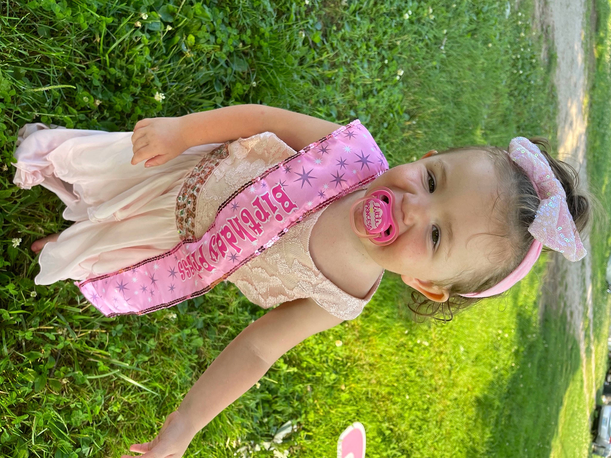 Layla joined the competition — help win amazing prizes! cool, facial_expression, fawn, grass, grass_family, grassland, happy, leisure, lip, meadow, people_in_nature, person, pink, plant, recreation, skin, smile, summer, thigh, toddler