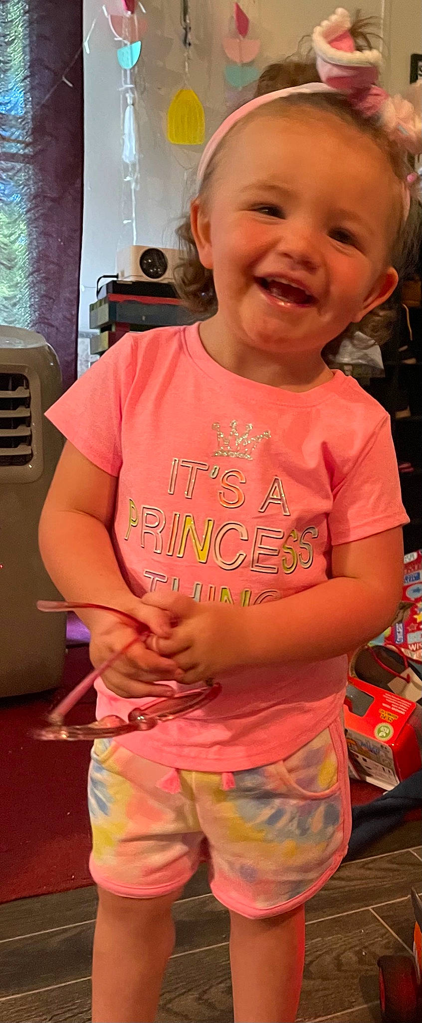 Layla is registered to the contest to win money with this photo: baby, baby_toddler_clothing, cheek, child, chin, cool, fun, happy, head, human, human_body, joy, lip, mouth, neck, organ, person, pink, skin, sleeve