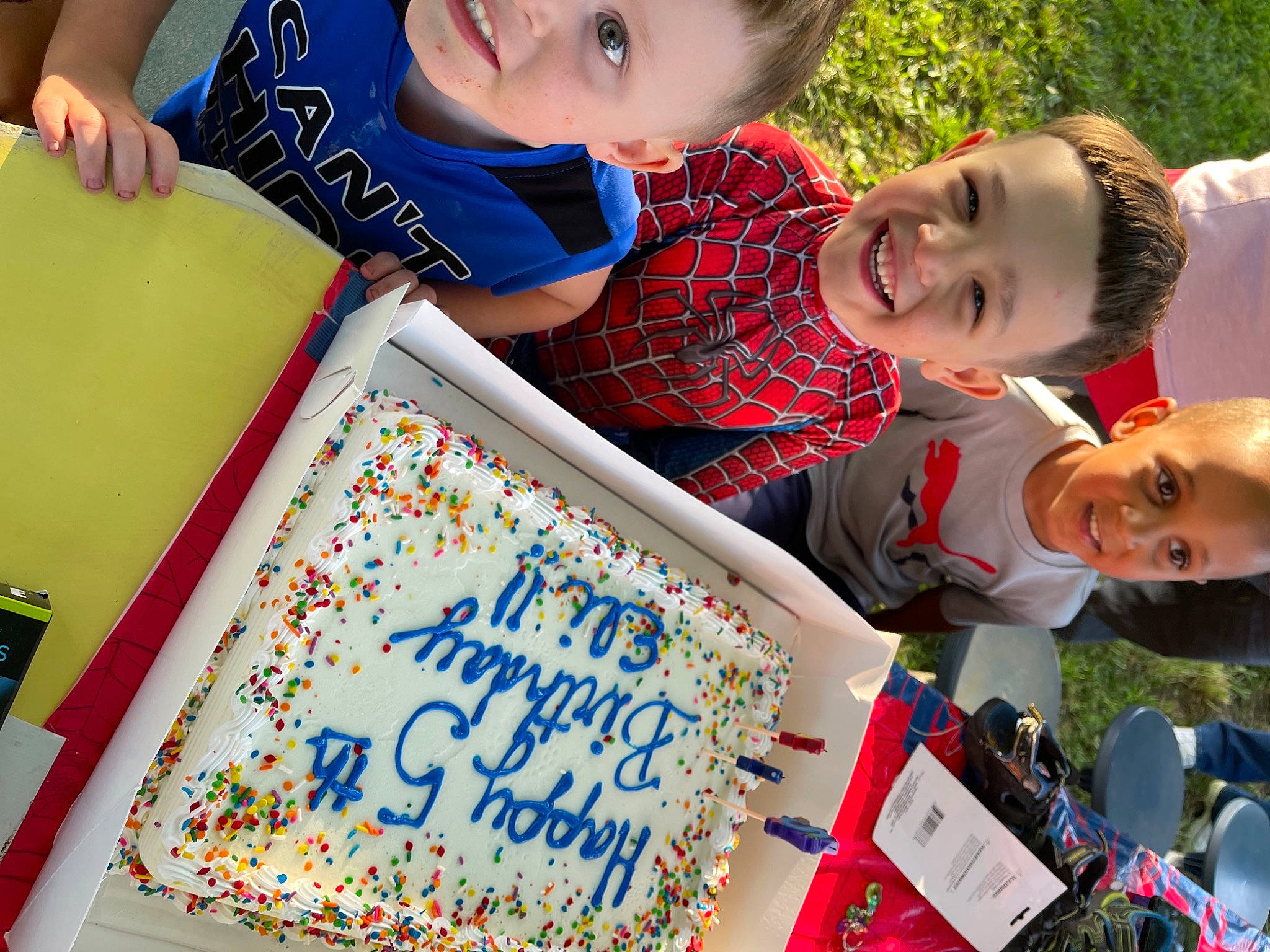 Jonas is registered to the contest to win money with this photo: birthday_cake, child, community, event, fun, grass, happy, joy, leisure, people, people_in_nature, person, photograph, product, recreation, red, sharing, smile, sugar_cake, t_shirt