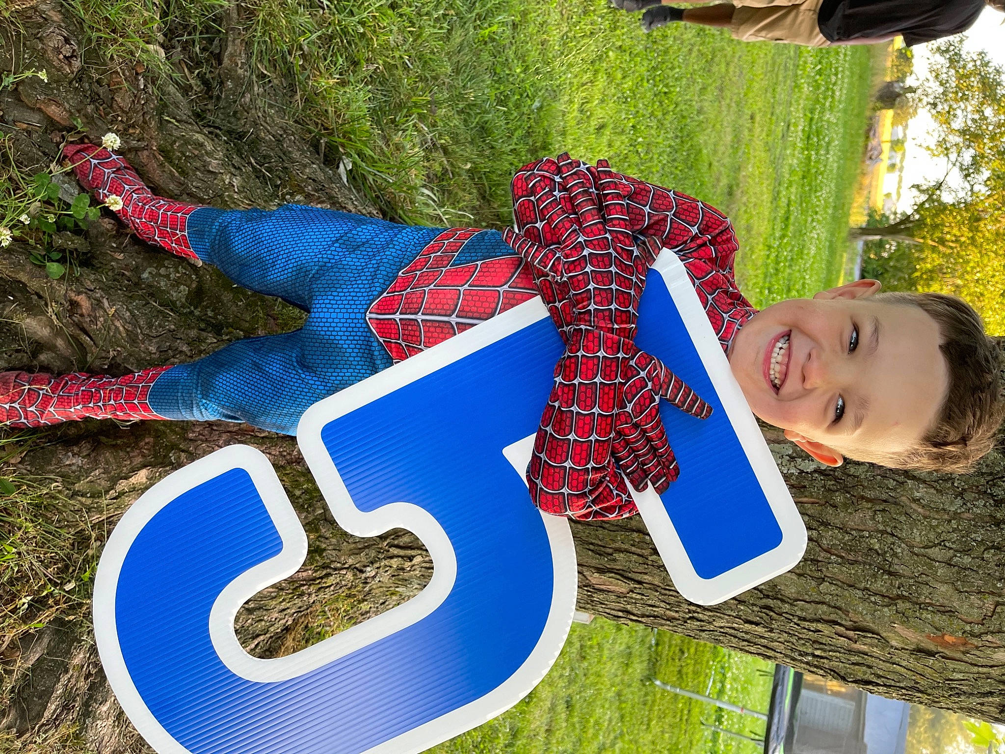 Jonas is registered to the contest to win money with this photo: carmine, cool, electric_blue, font, fun, grass, green, happy, joy, leisure, logo, pattern, people_in_nature, person, plaid, pole, public_space, recreation, sign, smile