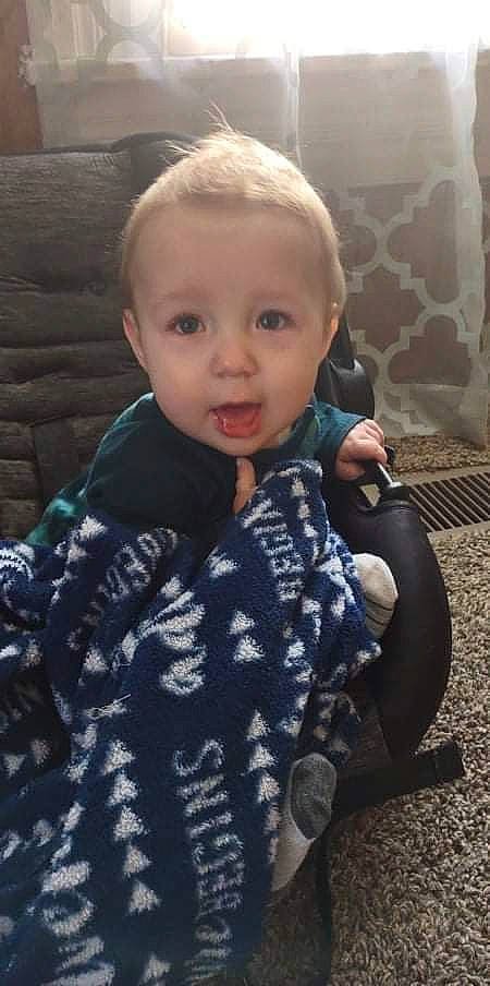 Eamon is registered to the contest to win money with this photo: baby, baby_toddler_clothing, beauty, cheek, child, comfort, eye, face, fun, grass, head, iris, outerwear, pattern, person, sitting, skin, sleeve, smile, standing