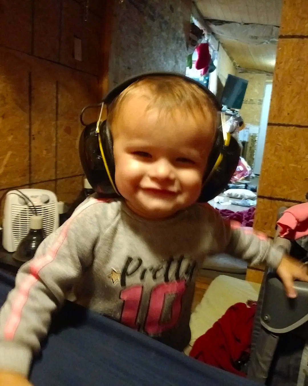 Stellaluna is registered to the contest to win money with this photo: audio_equipment, baby, baby_toddler_clothing, cheek, child, comfort, cool, ear, electronic_device, fun, gadget, gesture, happy, headphones, hearing, joy, output_device, peripheral, person, sleeve