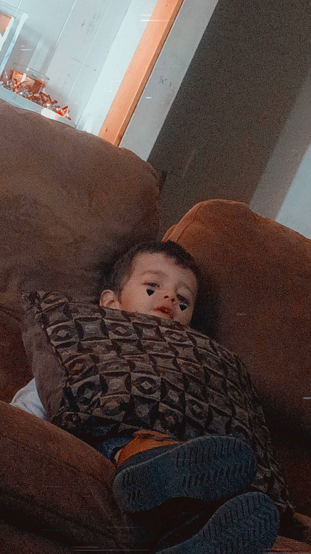 Kaleb joined the competition — help win amazing prizes! baby, child, comfort, couch, flooring, fun, human_leg, lap, leg, lighting_accessory, linens, living_room, person, room, sitting, tints_and_shades, toddler, wood