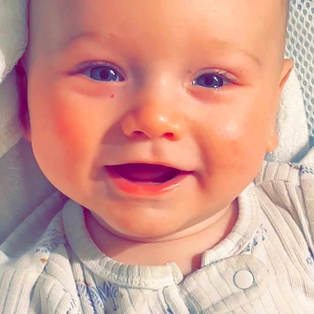 Levi joined the competition — help win amazing prizes! baby, babylaughing, clothing, coat, face, happy, head, jacket, laughing, newborn, person, photography, portrait, smile