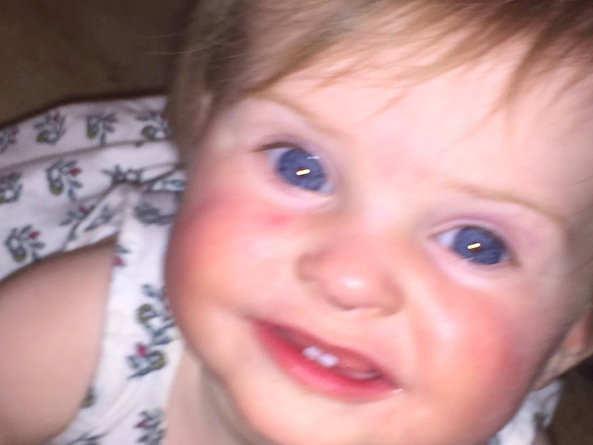 Katherine is registered to the contest to win money with this photo: cheek, child, chin, close_up, ear, emotion, eye, eyebrow, face, forehead, head, human_hair_color, infant, iris, lip, nose, person, skin, smile, toddler