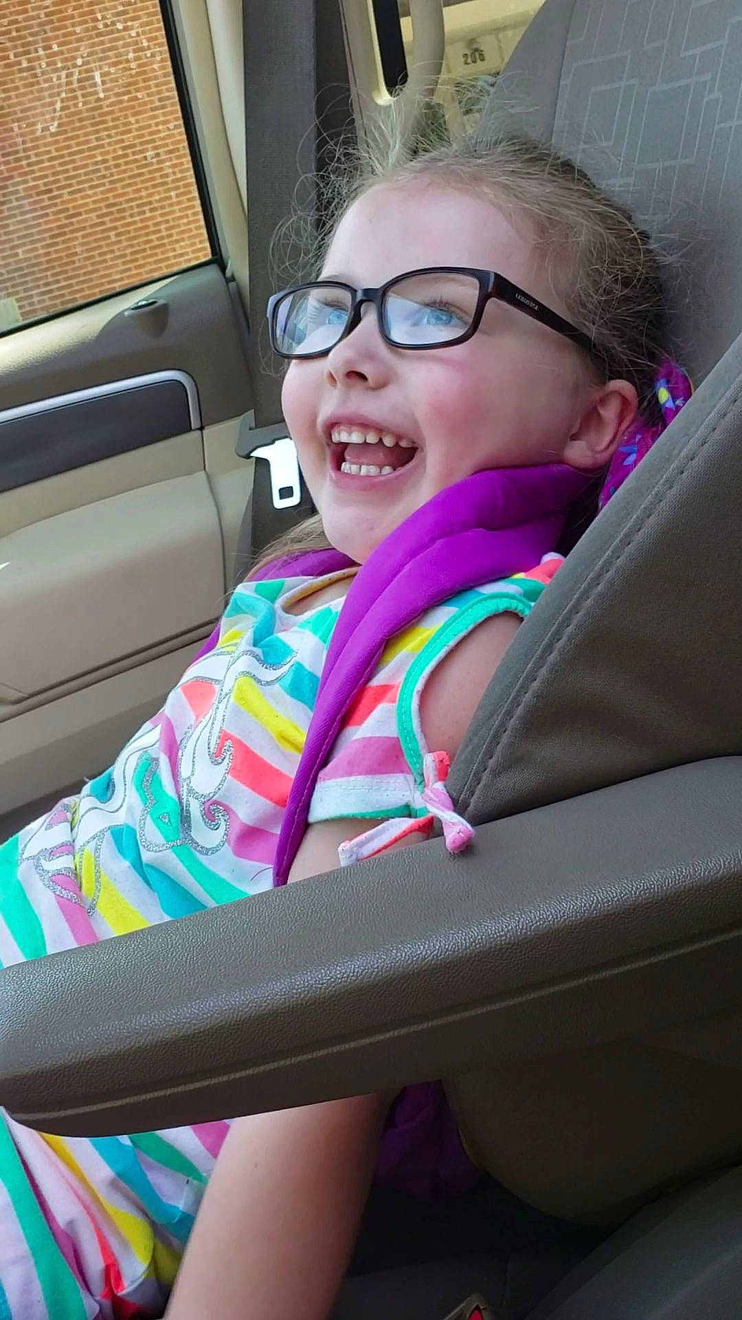 Brynn joined the competition — help win amazing prizes! auto_part, car, car_seat, child, cool, eyewear, facial_expression, fun, glasses, mouth, person, photography, pink, seat_belt, selfie, smile, sunglasses, vacation, vehicle, vehicle_door