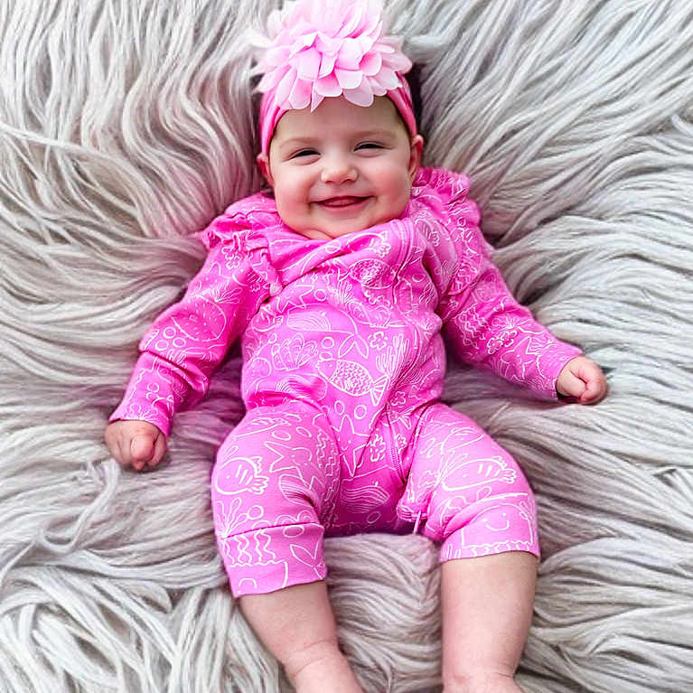 Brielle joined the competition — help win amazing prizes! accessories, baby, bodypart, cap, clothing, costume, dress, face, finger, happy, hat, head, homedecor, newborn, pants, person, photography, portrait, purple, smile