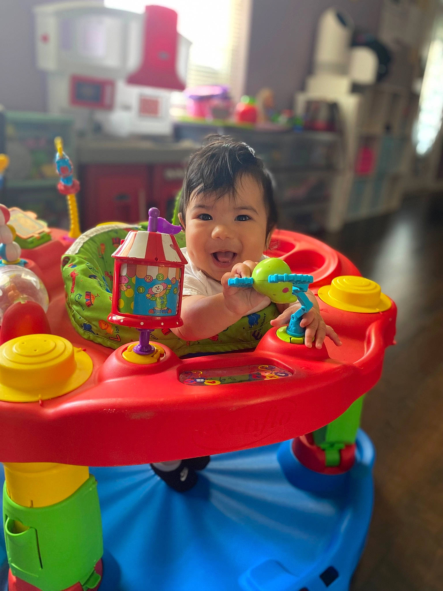 Lorenzo is registered to the contest to win money with this photo: amusement_ride, baby, baby_playing_with_toys, baby_products, baby_toys, child, event, fun, happy, leisure, nonbuilding_structure, person, plastic, play, recreation, riding_toy, sitting, smile, toddler, toy