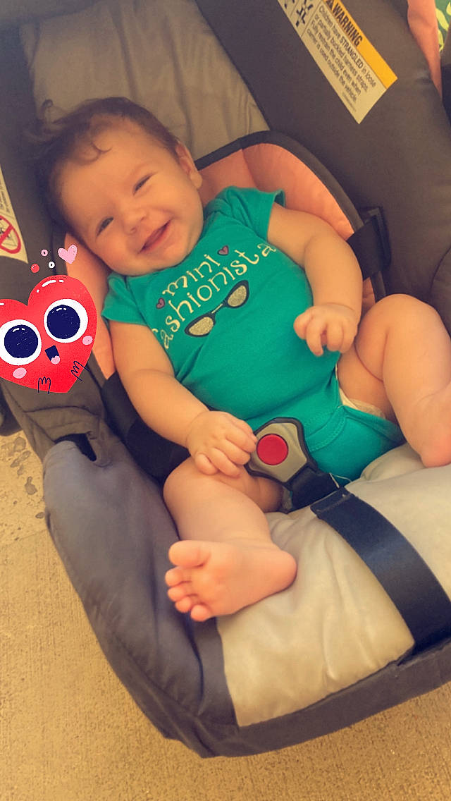 Alena is registered to the contest to win money with this photo: baby_toddler_clothing, comfort, facial_expression, finger, hand, happy, head, human_body, joint, knee, lap, leg, mouth, organ, person, skin, smile, textile, thigh, thumb