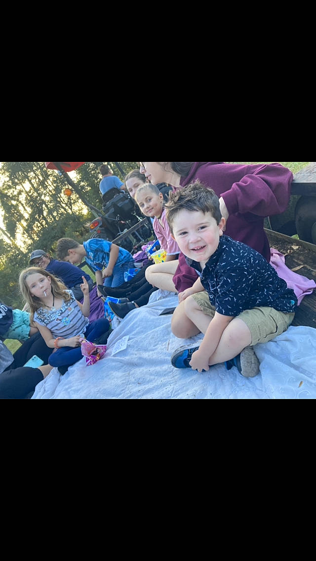 Casyn joined the competition — help win amazing prizes! baby, child, electric_blue, entertainment, event, face, flash_photography, fun, grass, happy, headwear, joy, leisure, magenta, performance, person, plant, purple, recreation, sitting