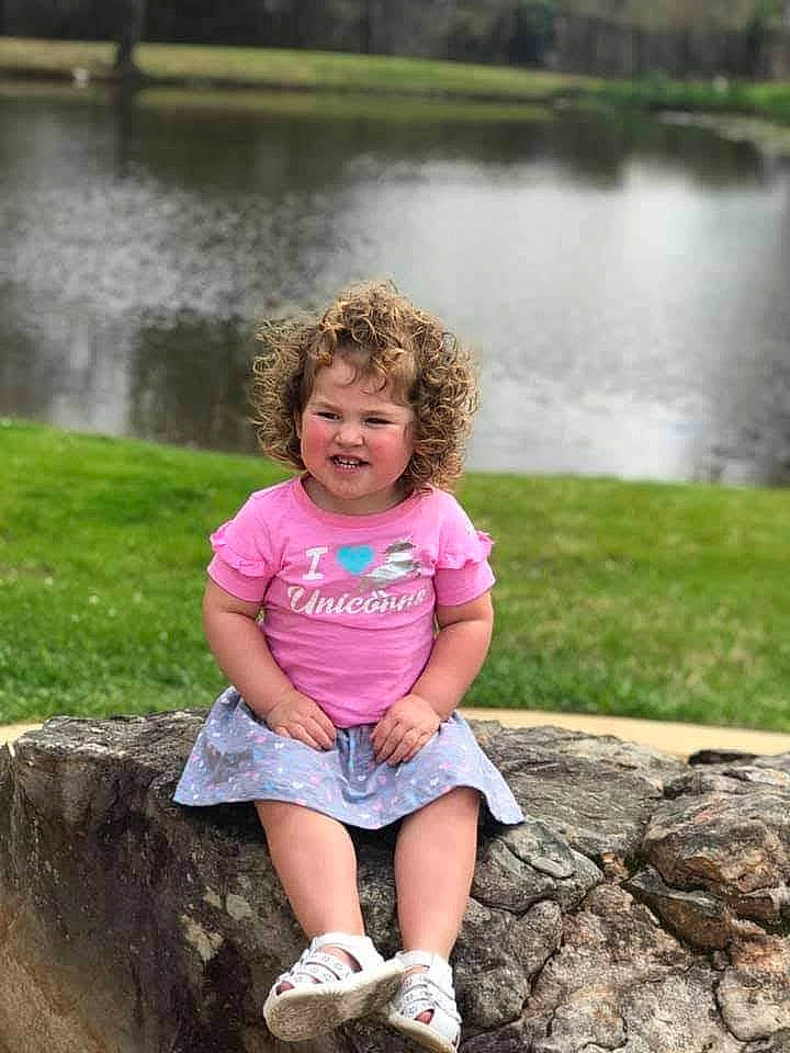 Jupiter is registered to the contest to win money with this photo: bank, botany, fun, grass, green, happy, lake, leaf, leisure, nature, people_in_nature, person, pink, plant, shorts, summer, tree, water, water_resources, watercourse