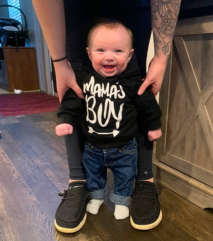 Kason is registered to the contest to win money with this photo: black, cool, elbow, gesture, happy, joint, knee, leg, person, shoe, shoulder, sleeve, smile, sneakers, sportswear, t_shirt, thigh, toddler, trunk, waist