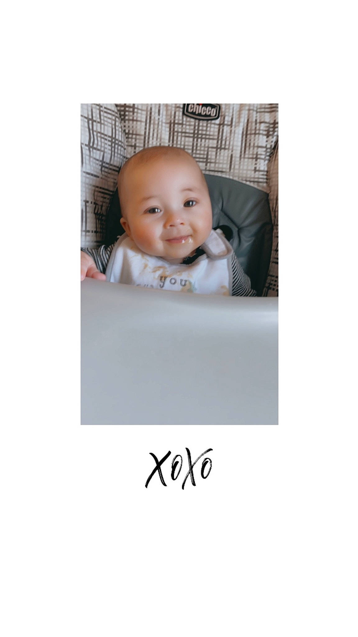 Aiden is registered to the contest to win money with this photo: baby, brand, child, comfort, eye, eyebrow, font, formal_wear, happy, joy, linens, person, portrait_photography, rectangle, room, shirt, sitting, sleeve, smile, t_shirt