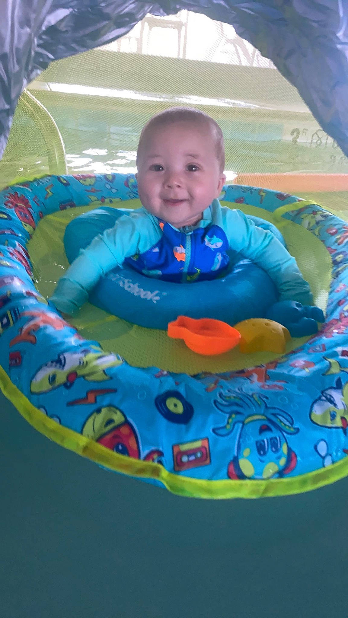 Aiden joined the competition — help win amazing prizes! aqua, baby, baby_products, baby_toddler_clothing, bathing, child, circle, comfort, fun, happy, head, inflatable, joy, leisure, person, pink, play, product, recreation, sitting