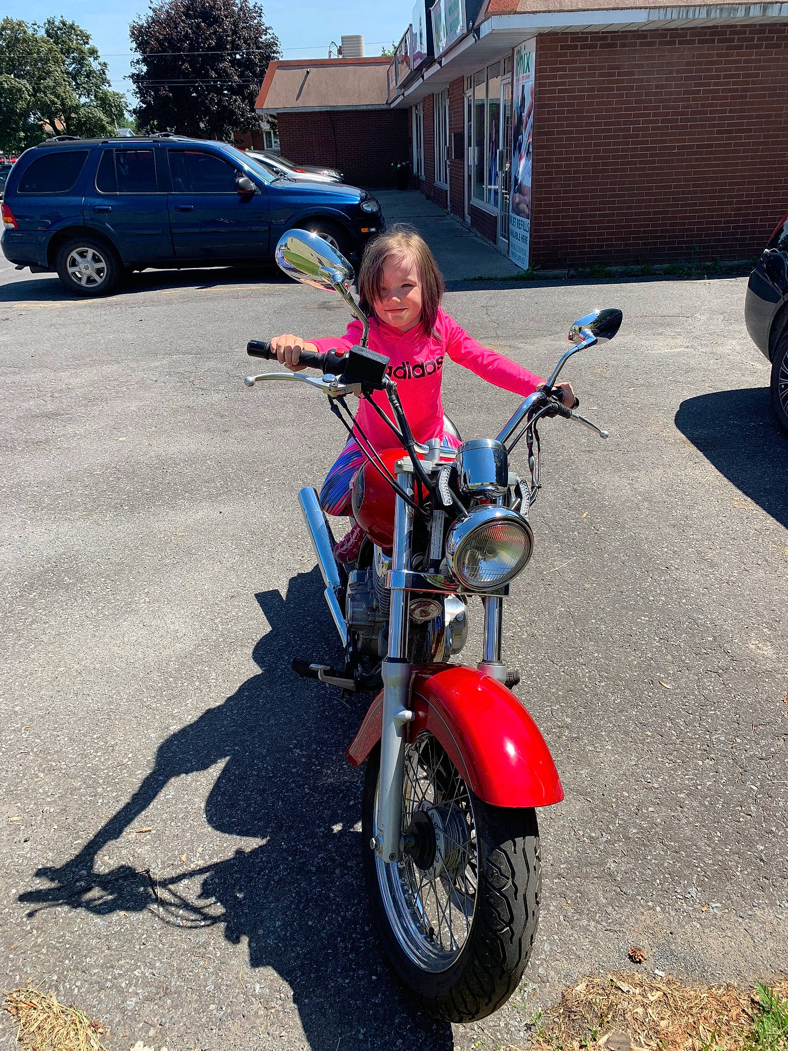 Ella-mae is registered to the contest to win money with this photo: asphalt, automotive_design, automotive_lighting, automotive_tire, bicycle_accessory, bicycle_frame, bicycle_handlebar, bicycles_equipment_and_supplies, car, fender, helmet, joy, land_vehicle, motor_vehicle, person, rim, sky, spoke, tire, toddler